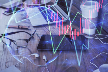 Double exposure of forex chart drawing and cell phone background. Concept of financial trading