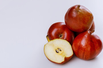 Fototapeta na wymiar Organic fruit red shiny pears isolated on white background.
