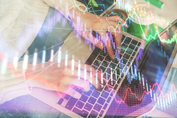 Double exposure of woman hands typing on computer and forex chart hologram drawing. Stock market invest concept.