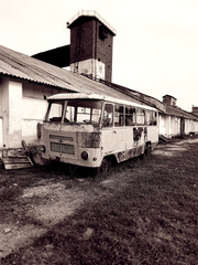 Old rusty car in an abandoned factory