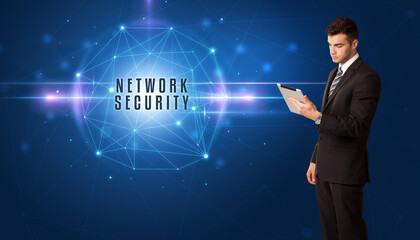 Businessman thinking about security solutions with NETWORK SECURITY inscription