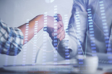Double exposure of forex graph hologram and handshake of two men. Stock market concept.