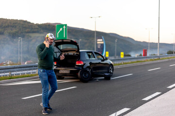 Driver with a big problem with the car on the highway