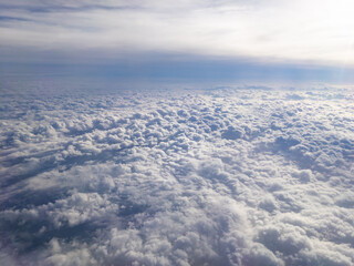 Aerial view between layers of small puffy altocumulus clouds and smooth altostratus clouds - obrazy, fototapety, plakaty