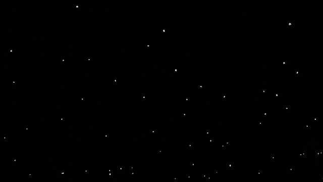 Bottom view of street decoration lights blinking. Sometimes they swing with wind and gets blurry motion.