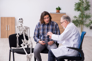 Young male patient visiting experienced doctor psychiatrist