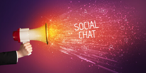 Young woman yelling to loudspeaker with SOCIAL CHAT inscription, social networking concept