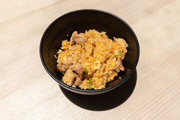 A bowl of chicken laksa fried rice.