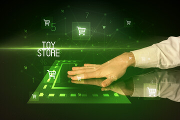 Online shopping with TOY STORE inscription concept, with shopping cart icons