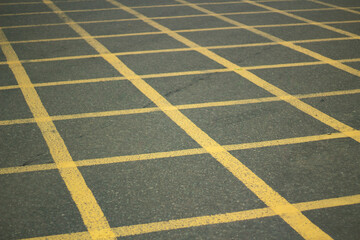 Fototapeta premium Junction markings for cars. Yellow markings to deal with traffic jams at crossroads. 