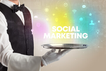 Waiter serving social networking with SOCIAL MARKETING inscription, new media concept