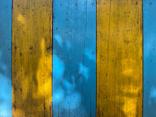 vintage yellow and blue wood background - old blue color wooden plank