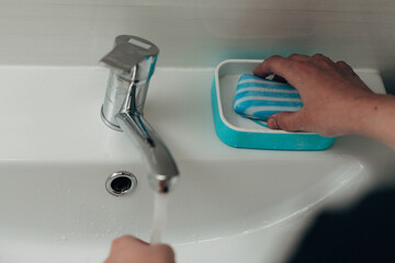 The Girl Washes Her Hands to Avoid Infection With the Virus COVID-19