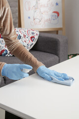 Cleaning and disinfecting home during Christmas holidays. Corona virus prevention concept.