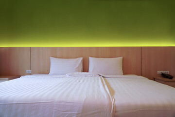 Double bedroom with white pillows and blanket.