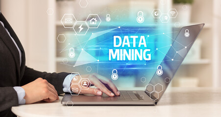 DATA MINING inscription on laptop, internet security and data protection concept, blockchain and cybersecurity