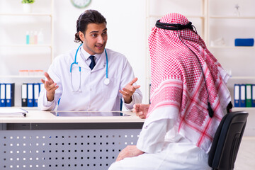 Old male arab visiting young male doctor