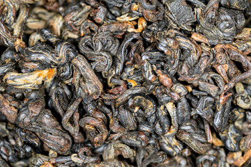 Chinese red tea Red Curls (Dianhong Hong Luo). Macro image 