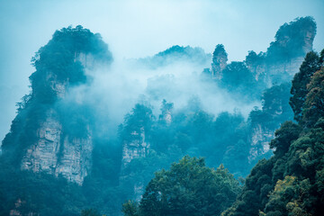 Amazing landscape of mountain and forest in the foggy at Wulingyuan, Hunan, China. Wulingyuan Scenic and Historic Interest Area which was designated a UNESCO World Heritage Site in China