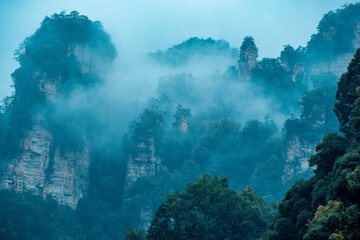 Amazing landscape of mountain and forest in the foggy at Wulingyuan, Hunan, China. Wulingyuan Scenic and Historic Interest Area which was designated a UNESCO World Heritage Site in China