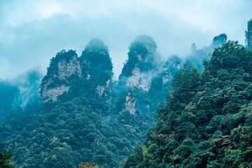 Naklejka na ściany i meble Amazing landscape of mountain and forest in the foggy at Wulingyuan, Hunan, China. Wulingyuan Scenic and Historic Interest Area which was designated a UNESCO World Heritage Site in China