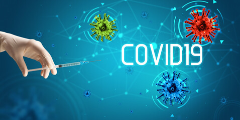 Syringe, medical injection in hand with COVID19 inscription, coronavirus vaccine concept