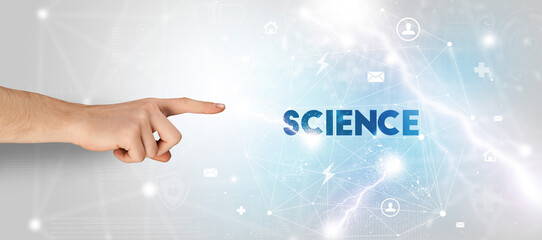Hand pointing at SCIENCE inscription, modern technology concept