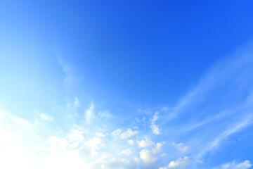 Naklejka na ściany i meble Bright blue sky with white clouds, Natural background