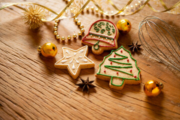 Composition of handmade Christmas ornaments and cookies.