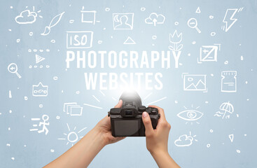 Hand taking picture with digital camera and PHOTOGRAPHY WEBSITES inscription, camera settings concept