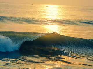 sunset and the wave