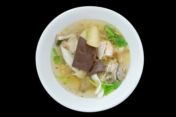 Top view of boiled rice soup with seafood (shrimps, squid and fish).