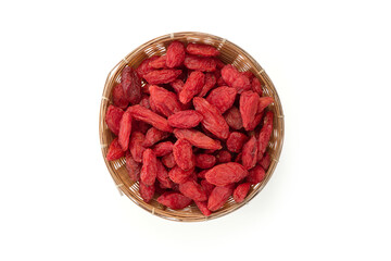 Flat lay, top view dried gojiberry in a bamboo basket isolated on white background.