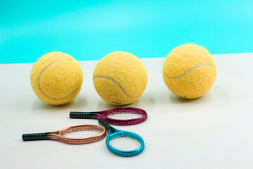 Tennis balls are on blue background