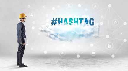 Engineer working on a social media concept with #HASHTAG inscription
