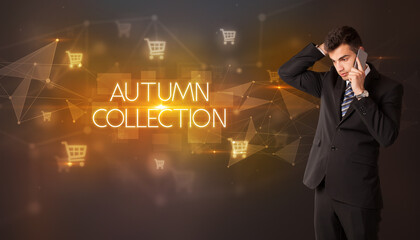 Businessman with shopping cart icons and AUTUMN COLLECTION inscription, online shopping concept