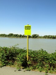 High pressure and Gas pipeline warning sign near Fraser river. Richmond, BC, Canada