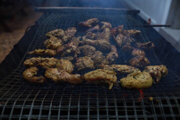 BBQ Honey Chicken, Malaysian food is on the grill with smoke.