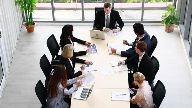 The supervisor blamed the intern for the wrong job at the meeting. Young people work in modern office. Professional business team success.