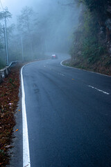 misty fog over empty road in mountains