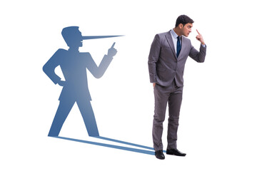 Obraz premium Concept of businessman liar with his shadow