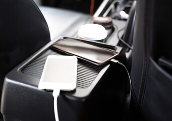 Plug to charge mobile phone in the car.