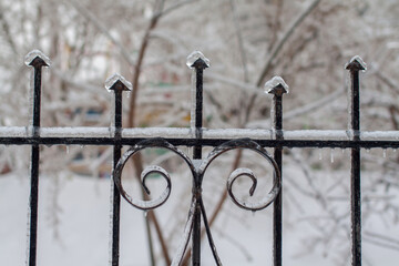 Glazed with ice fence after the cyclone