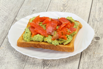 Toast with guacamole and salmon