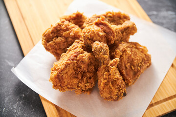 crispy southern style fried chicken in a black stone table