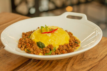 Rice topped with stir-fried pork and basil scrambled eggs