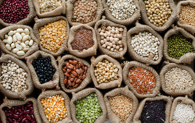 Variety kinds of natural cereal and grain seed in sack and dark tone, for clean food raw material...