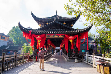  Street view local visitor and tourist in Furong Ancient Town (Furong Zhen, Hibiscus Town), China. Furong Ancient Town is famous tourism attraction place.