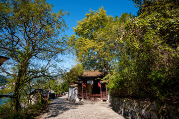 Obraz premium Street view local visitor and tourist in Furong Ancient Town (Furong Zhen, Hibiscus Town), China. Furong Ancient Town is famous tourism attraction place.