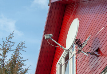 satellite dish on the front of the house, digital TV development concept